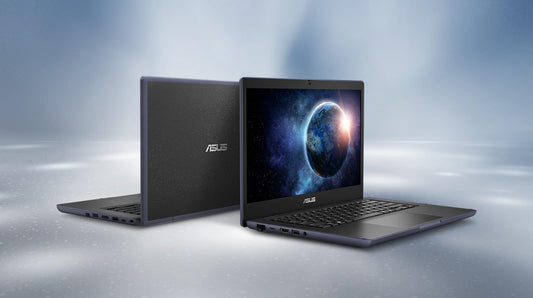 Two ASUS laptops on a reflective surface with a gradient blue background